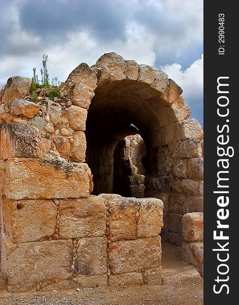 Arch overlapping of a tunnel for spectators in an antique amphitheater nearby Israel. Arch overlapping of a tunnel for spectators in an antique amphitheater nearby Israel