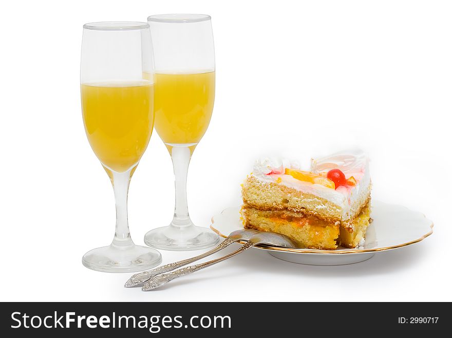 Cake and juice on a white isolated background. Cake and juice on a white isolated background