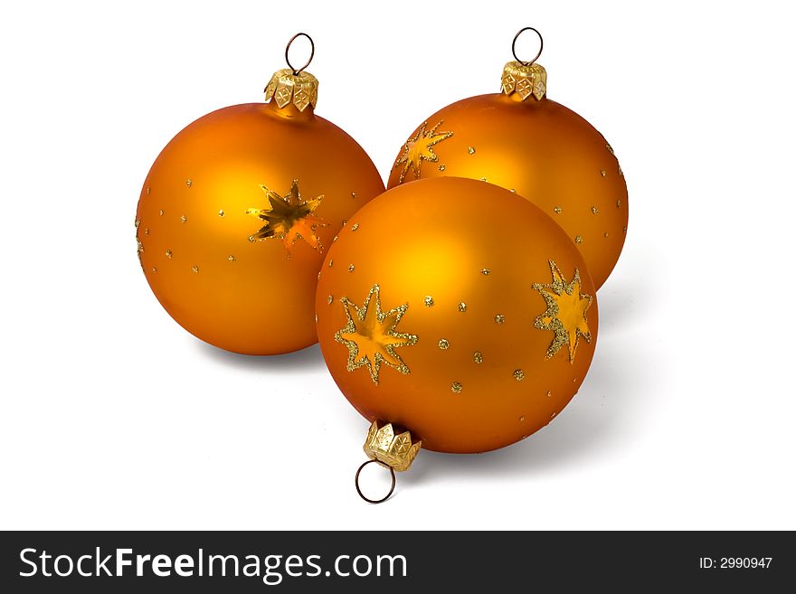 Three orange Christmas tree ornaments on white background. Three orange Christmas tree ornaments on white background