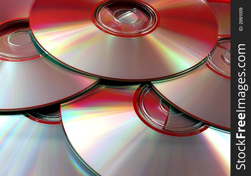 An assortment of compact discs, full frame.