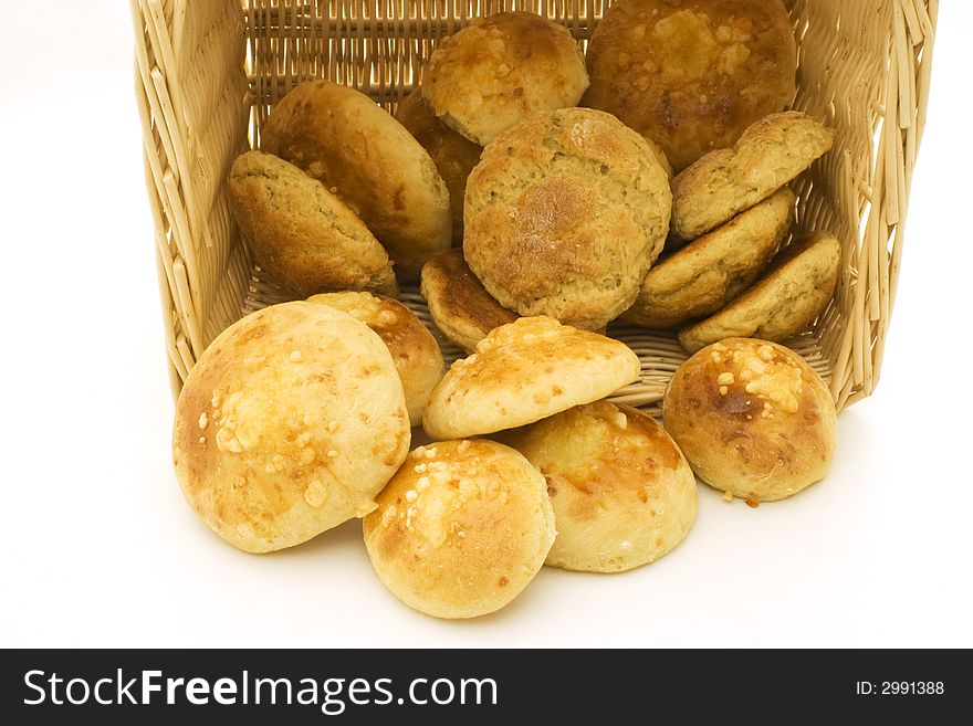 A basket of homemade bread on white background. A basket of homemade bread on white background.