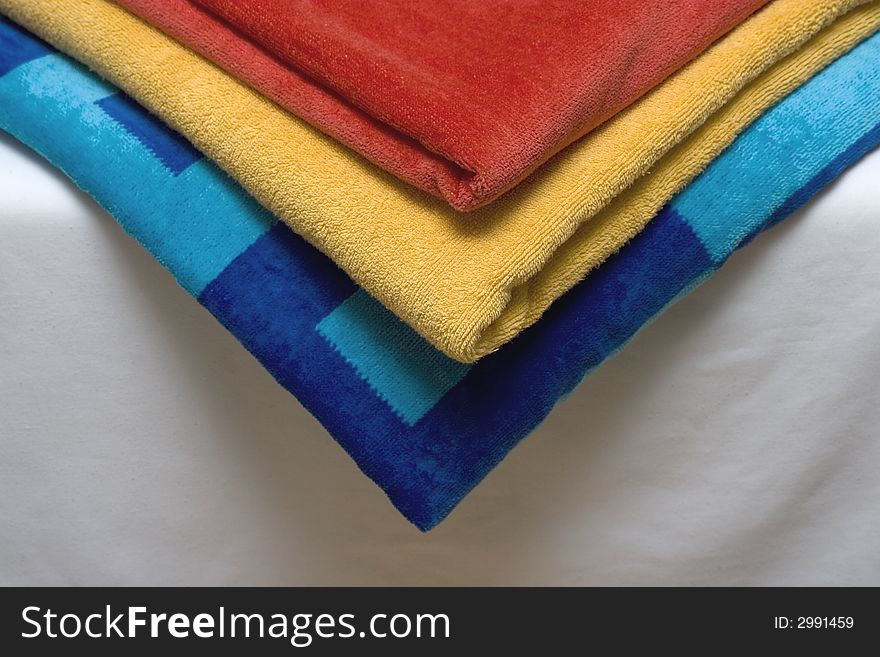 Colorful Vivid Towels on a Bed