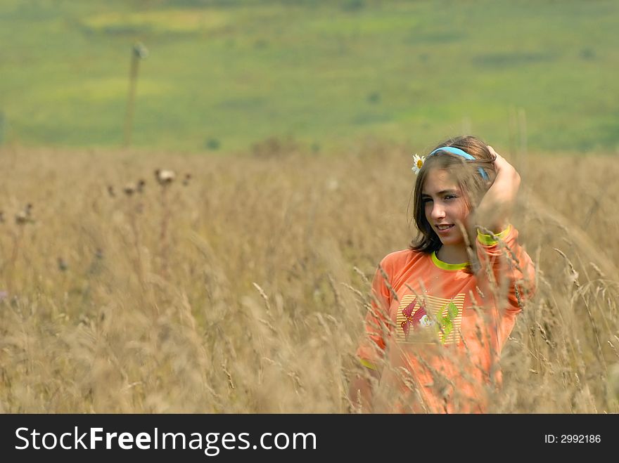 Girl with camomile on a meadow. Girl with camomile on a meadow