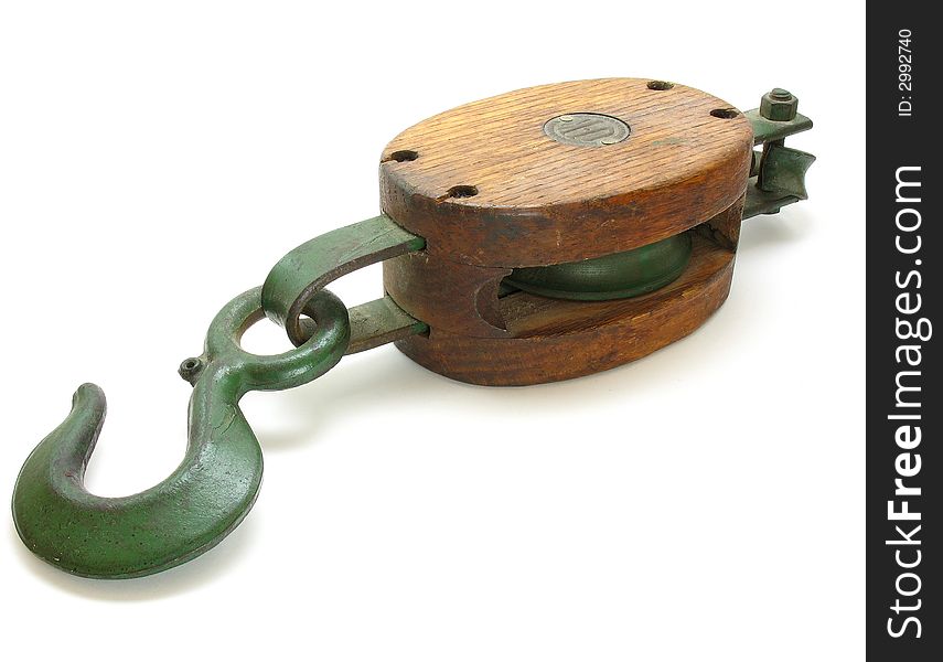 This is an antique pulley and hook shot on a white background. This was taken off of an old ship.