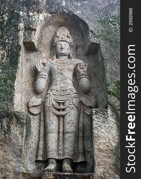Old rock-carved figure Kustoraja near Weligama, Sri Lanka