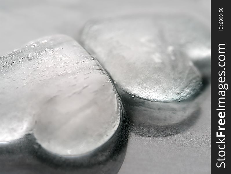 Ice hearts on grey background