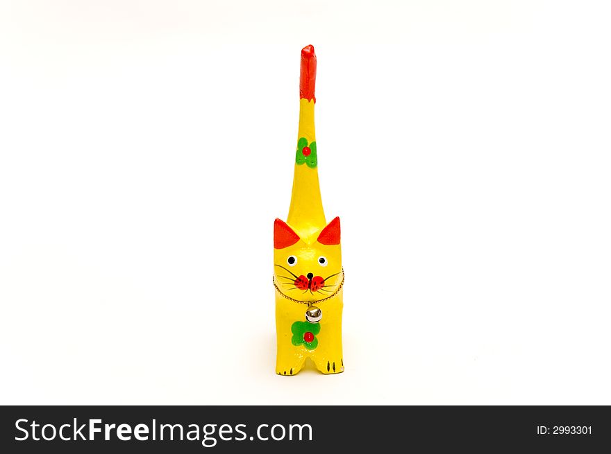 Wooden yellow kitten isolated over white. Wooden yellow kitten isolated over white