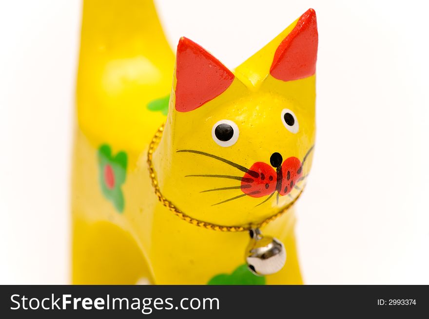 Wooden yellow kitten close up