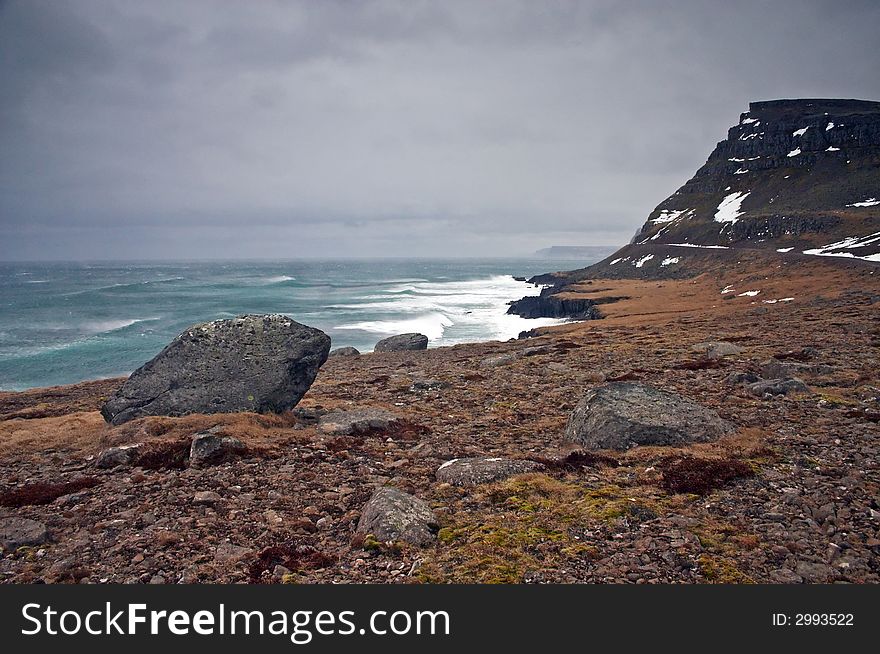 Icelandic landscape with rocks and sea