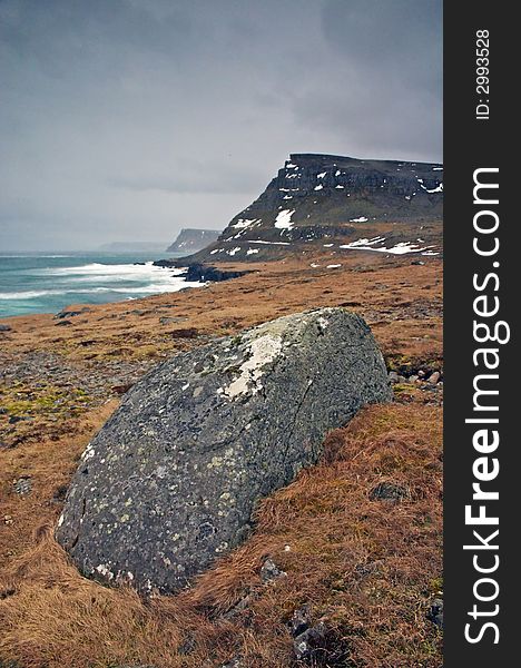 Icelandic landscape with rocks and sea