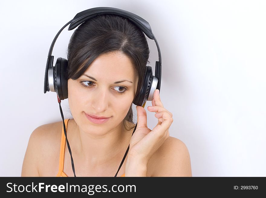 Young beautiful girl listening music