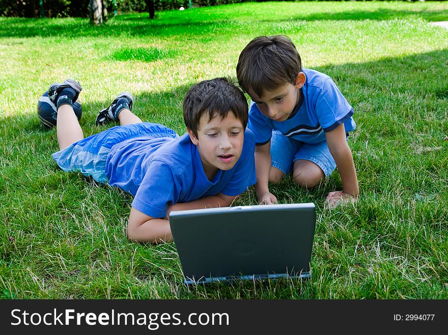 Two Cute Boy Study On Computer