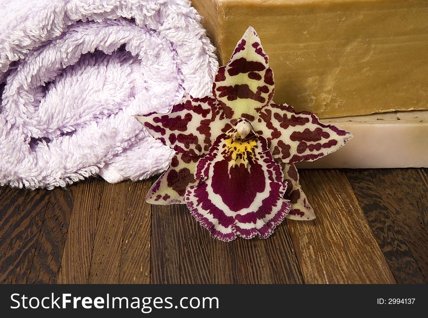 Aroma bath items. towel, soap and orchid. Aroma bath items. towel, soap and orchid