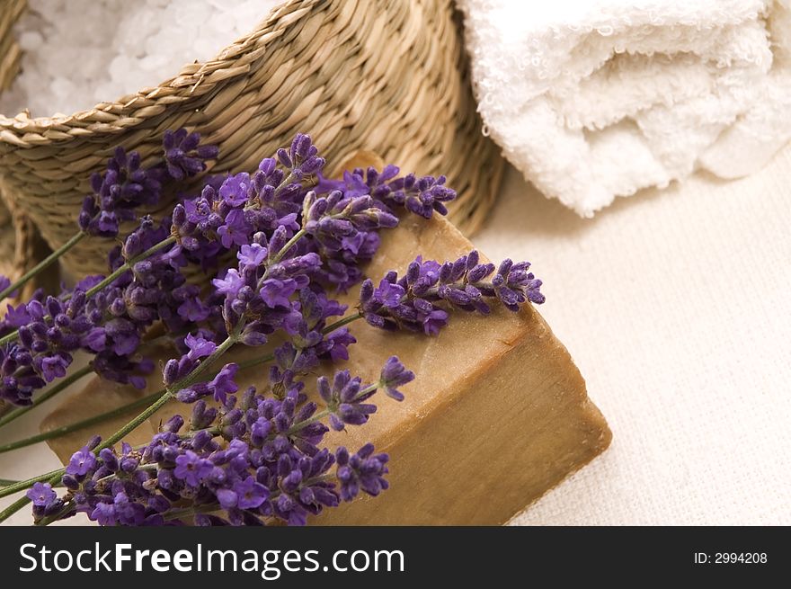 Aroma bath items. salt, towels, soap and fresh lavender flowers. Aroma bath items. salt, towels, soap and fresh lavender flowers