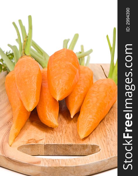 Fresh carrots on the wooden cutting board. Fresh carrots on the wooden cutting board