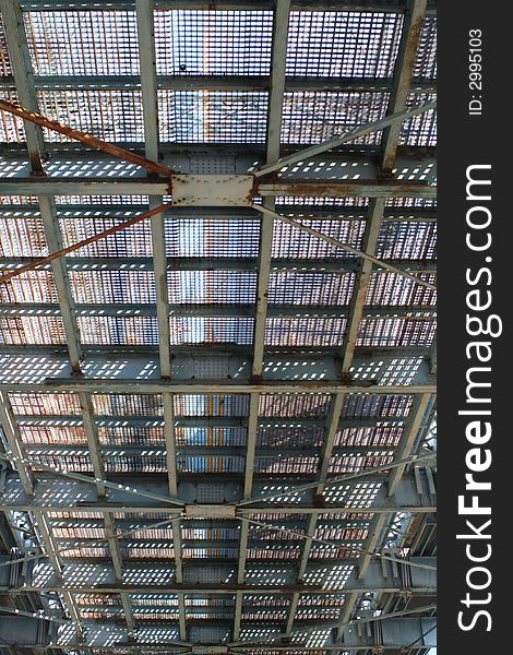 Looking up into the metal road of a bridge. Looking up into the metal road of a bridge.