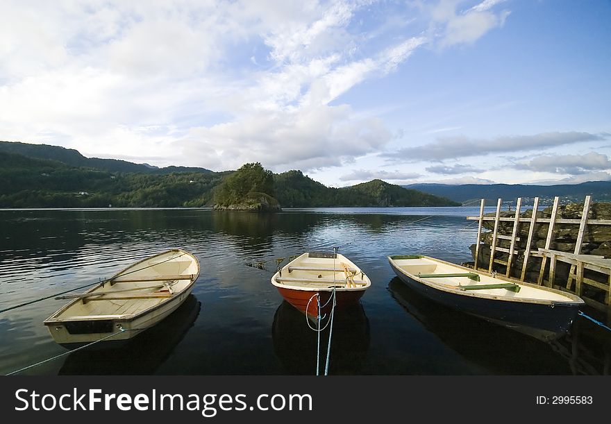 Three boats moored, a wooden jetty at the right, fjord, Norway, Hordaland.

<a href='http://www.dreamstime.com/sea-fishing-rcollection7072-resi208938' STYLE='font-size:13px; text-decoration: blink; color:#FF0000'><b>SEA FISHING COLLECTION Â»</b></a>. Three boats moored, a wooden jetty at the right, fjord, Norway, Hordaland.

<a href='http://www.dreamstime.com/sea-fishing-rcollection7072-resi208938' STYLE='font-size:13px; text-decoration: blink; color:#FF0000'><b>SEA FISHING COLLECTION Â»</b></a>