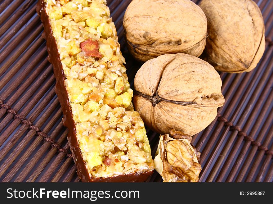 Muesli stick on white background and nutrition