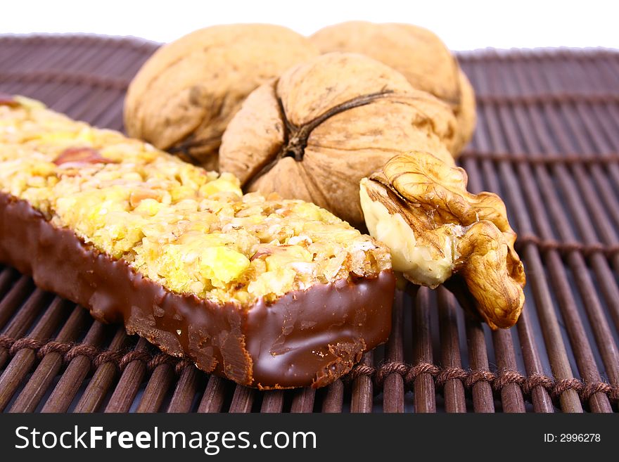 Muesli stick on white background and nutrition