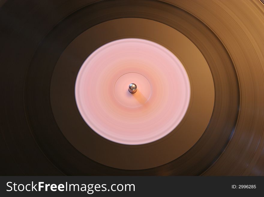 A spinning record on a turntable