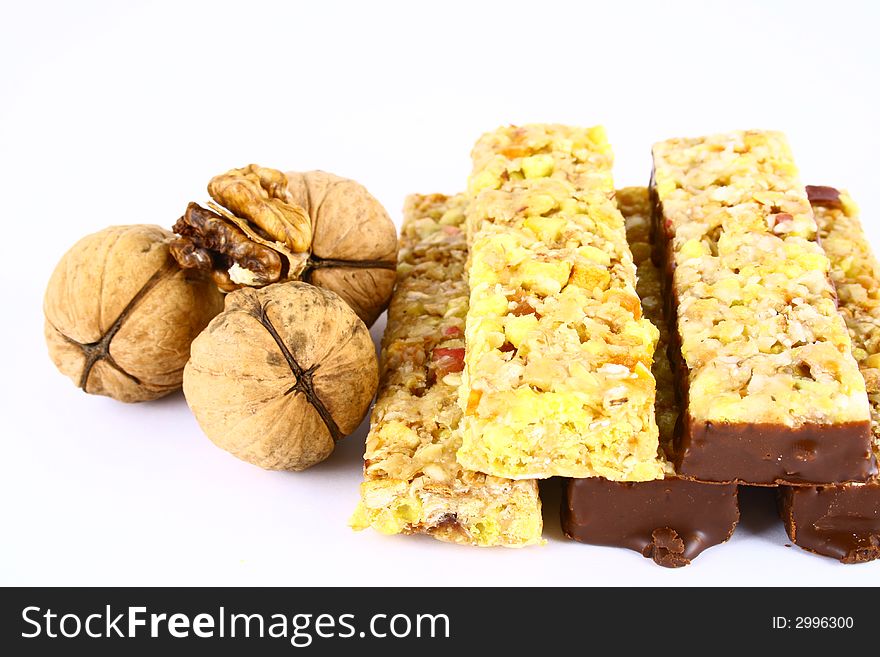 Muesli stick on white background and nutrition