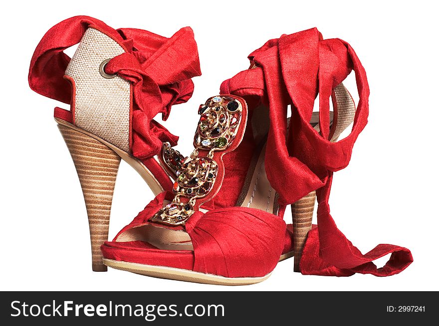 Female red shoes with tapes on a white background