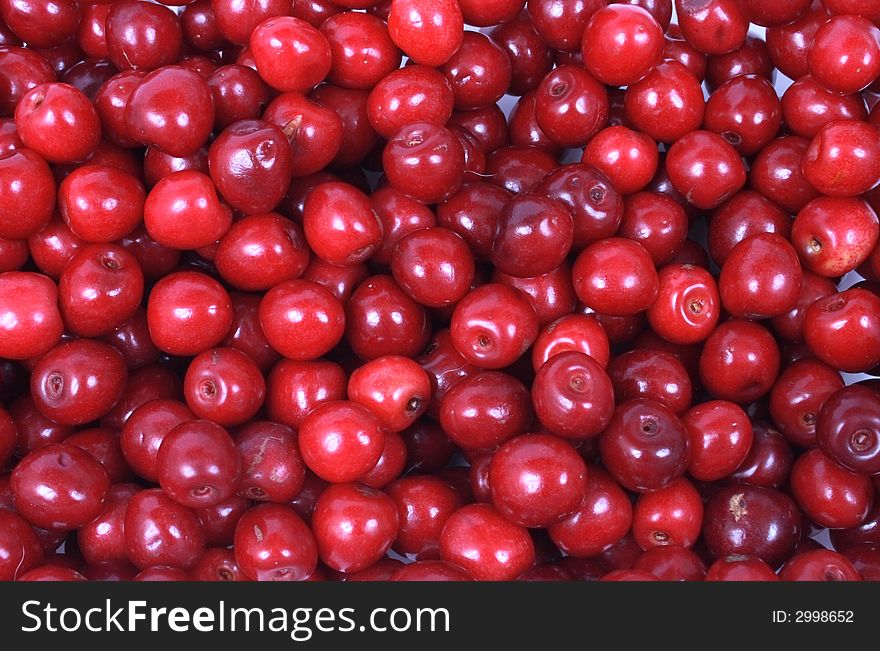 Juicy background from the red cherries