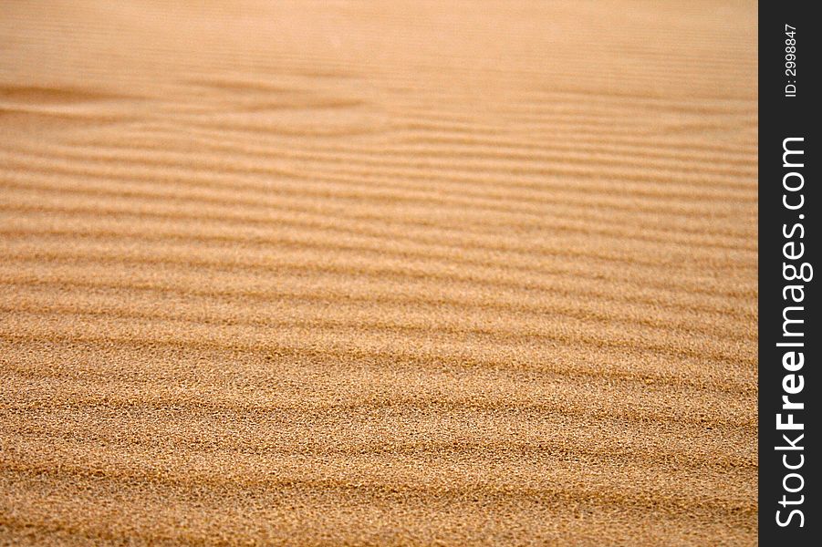 Dune sand texture, 
dark, gold sand