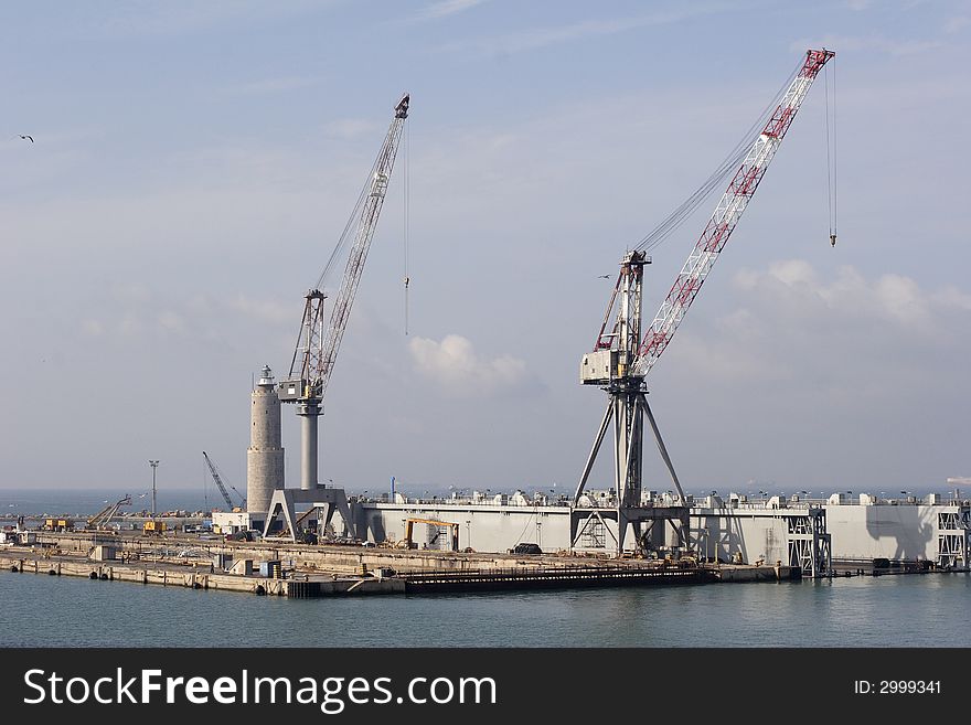 Loading cranes on dockside, livorno Italy