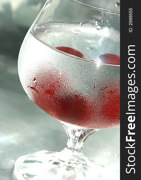 Cherry in glass of mineral water. Cherry in glass of mineral water