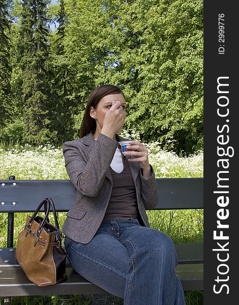 Business lunch in the park, young woman. Business lunch in the park, young woman