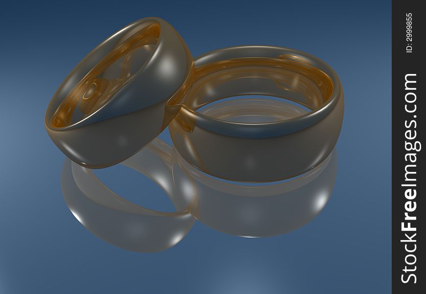 Weddings golden rings on reflective surface. Weddings golden rings on reflective surface
