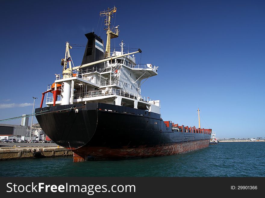 General cargo ship working in the port of Alicante; Spain.