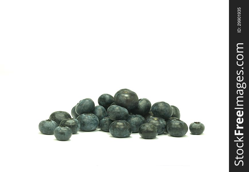 Pile of ripe blue berries on white background