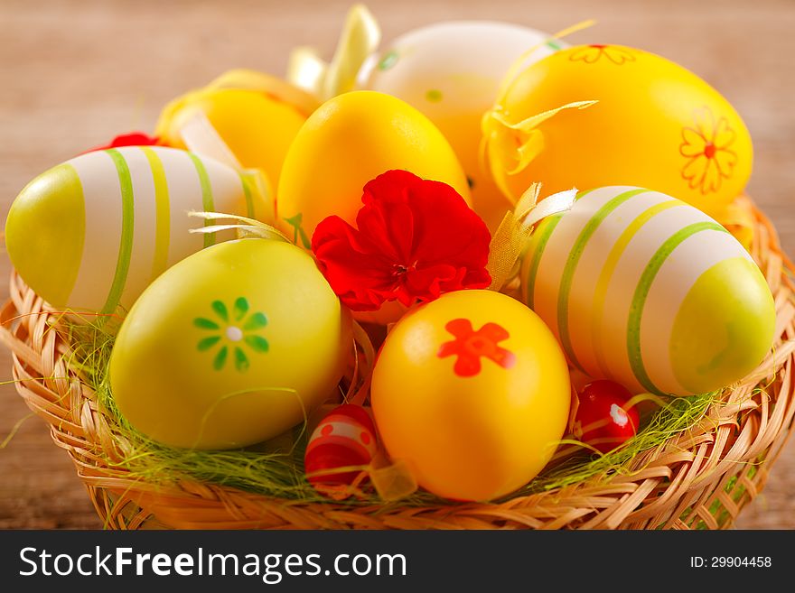 Colorful easter eggs in a wicker basket