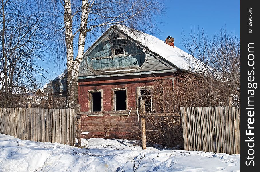 Old abandoned wooden house, winter time