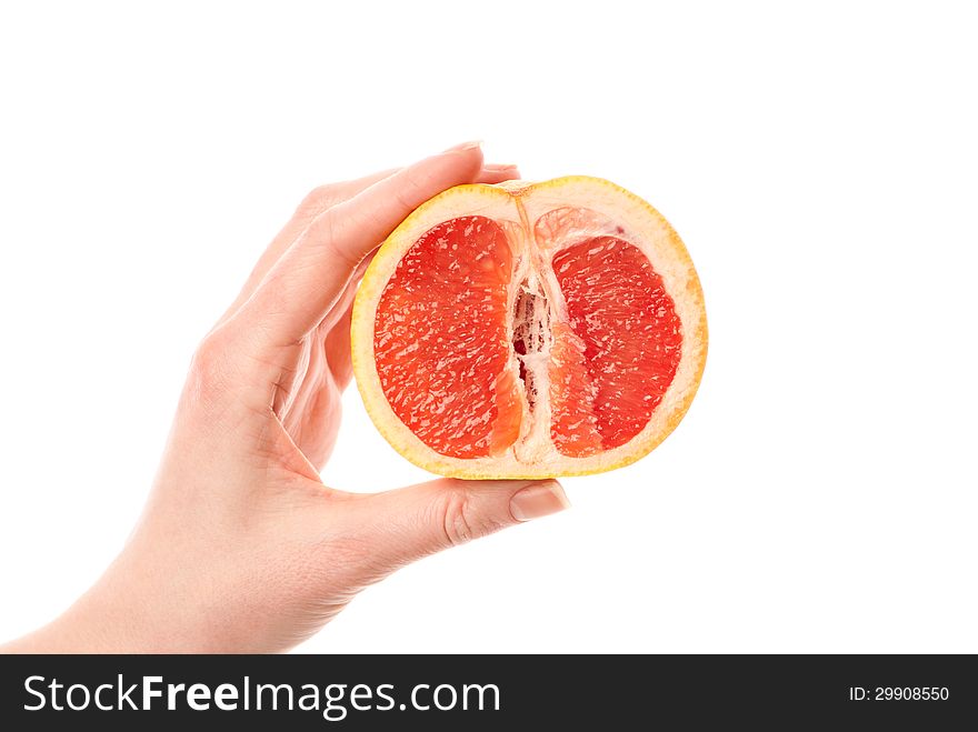 Female hand holdin grapefruit. White background. Studio shot. Female hand holdin grapefruit. White background. Studio shot