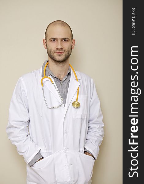 Portrait of a doctor of stethoscope isolated on light background