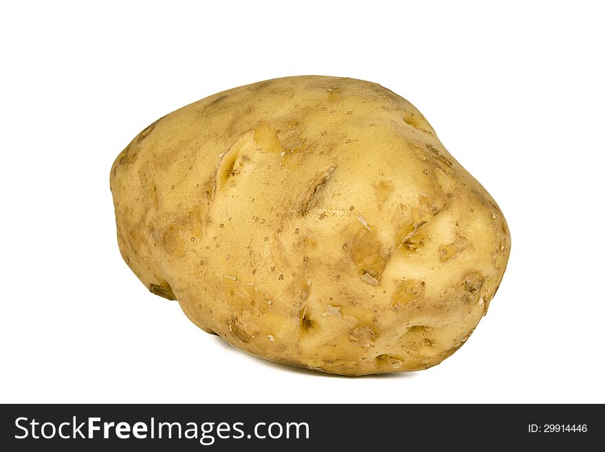 Large size potato on white background. This giant potato, about 6 inch long when weighed found to be approx. 450 gms.