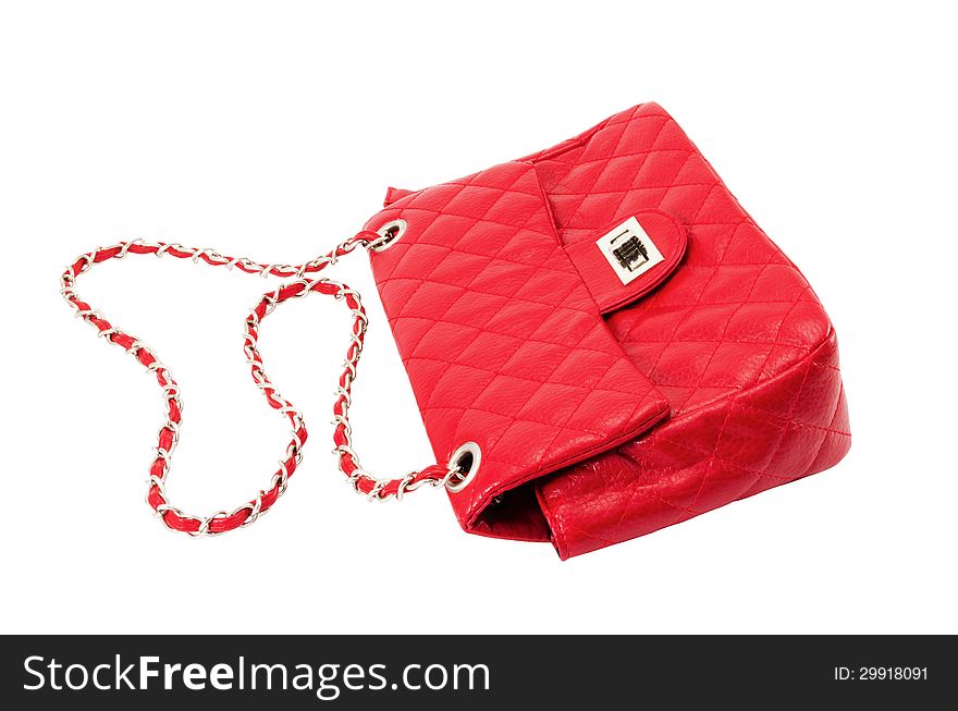 Female handbag of red colour isolated on a white background