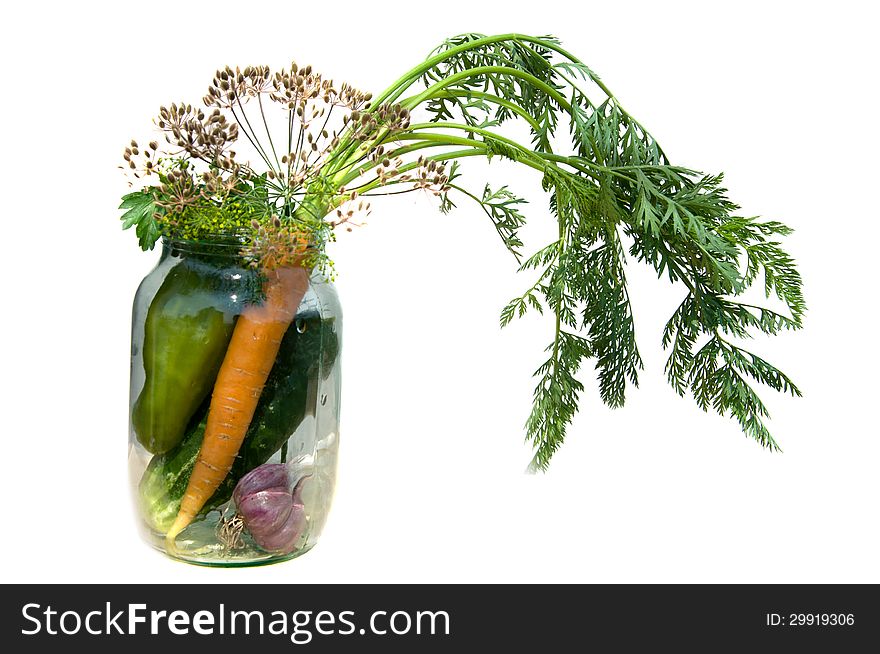 Pepper, carrot, cucumber, dill and garlic in a glass jar. Pepper, carrot, cucumber, dill and garlic in a glass jar.