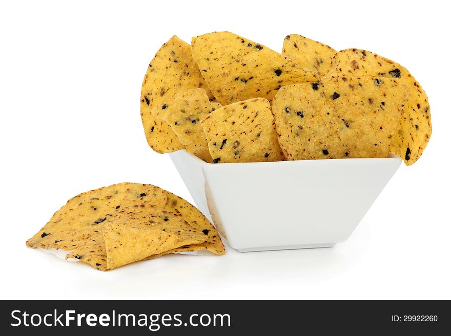 Tortilla chips in a porcelain bowl over white background.