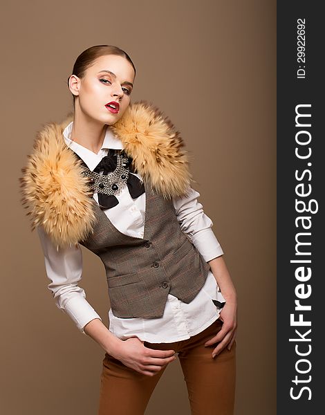 Fashion Woman in Grey Waistcoat and Fur Collar. Fashion Woman in Grey Waistcoat and Fur Collar