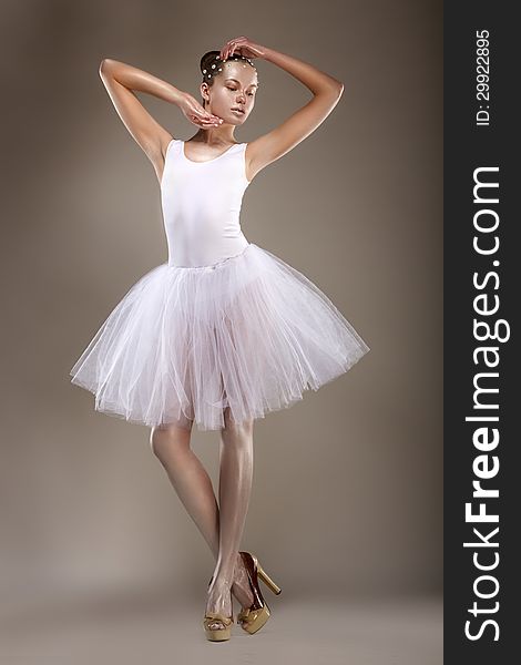 Ballet. Graceful Ballerina In White Light Tutu - Performance. Fantasy