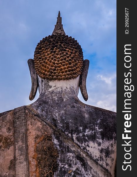 Detail of head of stone statue of sitting Buddha in Sukhothai hi