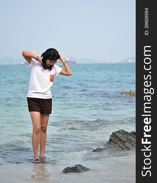 Beautiful young asian woman on beach summer holiday