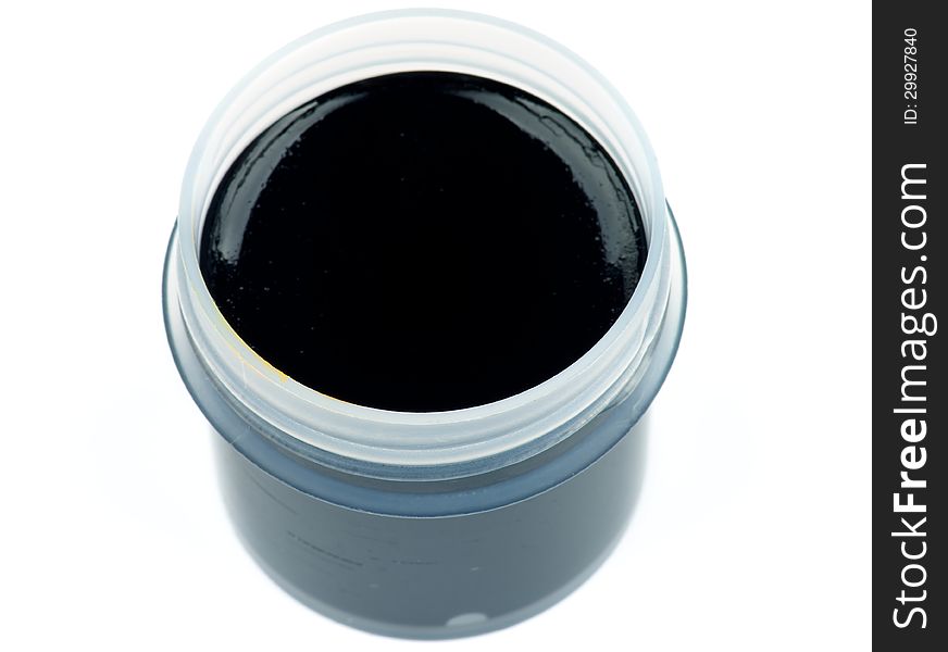 Container with Black Gouache Paint isolated on white background. Top View