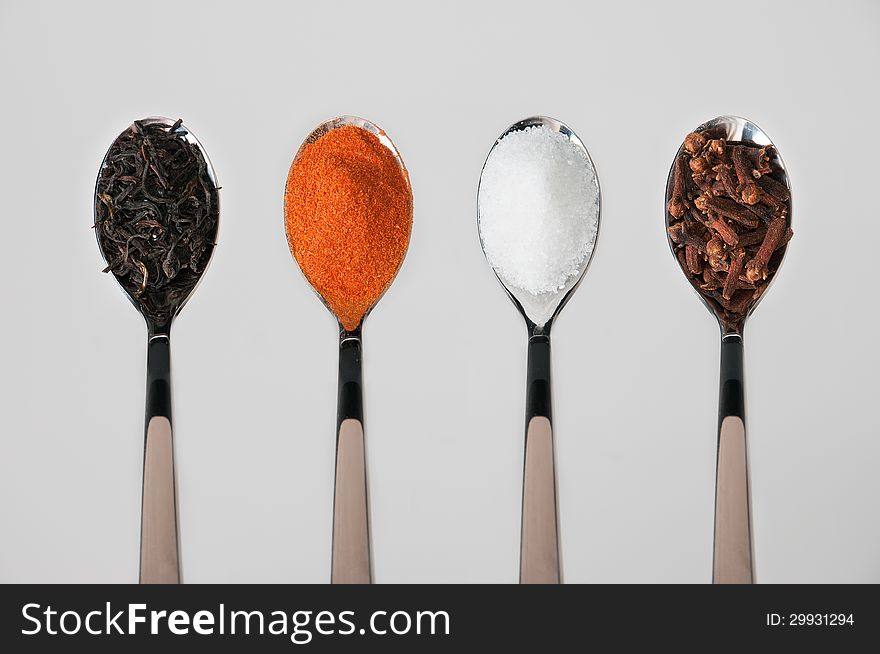 Spoons with various spices, arranged in series. Spoons with various spices, arranged in series