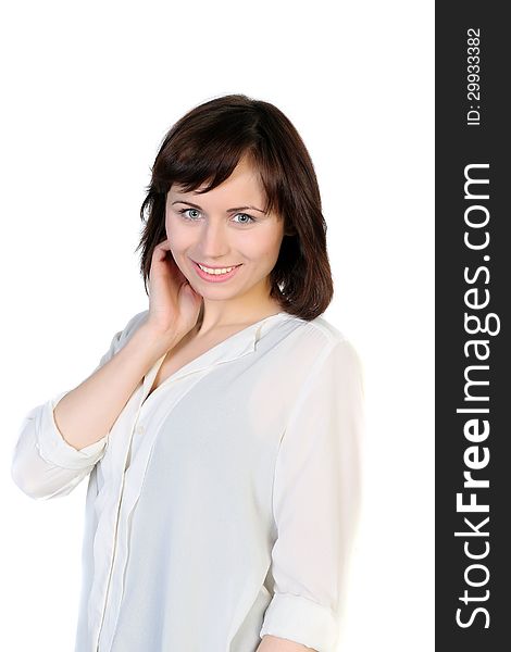 Portrait of a young brunette attractive woman in a white blouse isolated over white background. Portrait of a young brunette attractive woman in a white blouse isolated over white background