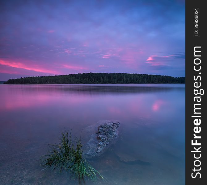 Lake shore at twilight. Long exposure, beautiful sunset. Lake shore at twilight. Long exposure, beautiful sunset